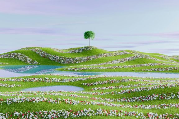 Lush green hills covered with flowers and a single tree under a pastel sky.